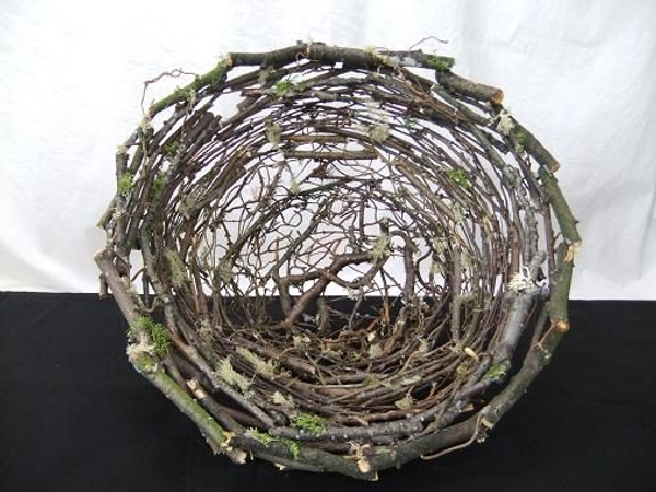 Stack and glue twigs to create a twig nest Stack and glue twigs to create a twig nest