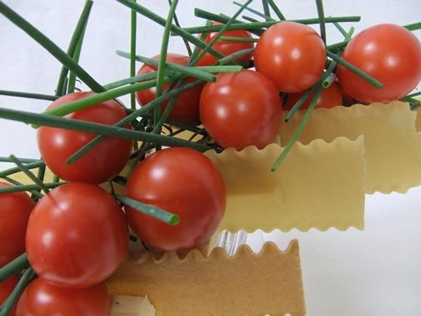 Vine tomatoes, lasagne and chive centerpiece. Vine tomatoes, lasagne and chive centerpiece.