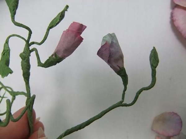 Add the buds to the stems and tape Add the buds to the stems and tape