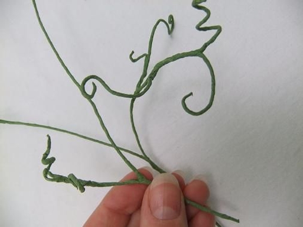 Curl the wire to give it dramatic tendrils Curl the wire to give it dramatic tendrils
