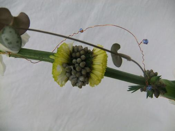 Detail of the floral lariat necklace design.