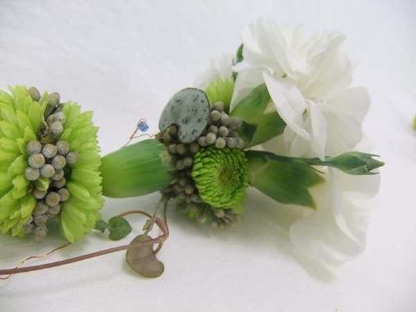 End the lariat necklace with a carnation tassle. End the lariat necklace with a carnation tassle.