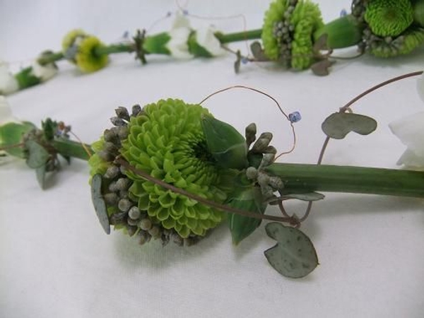 Floral lariat necklace with tiny pompon pom-poms. Floral lariat necklace with tiny pompon pom-poms.