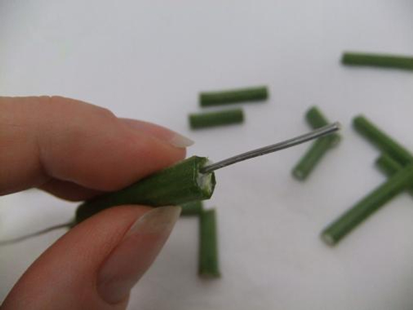 Pierce a hole through the spongy stem to string
