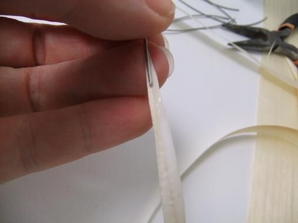 Place the wire on the wet glue. Place the wire on the wet glue.