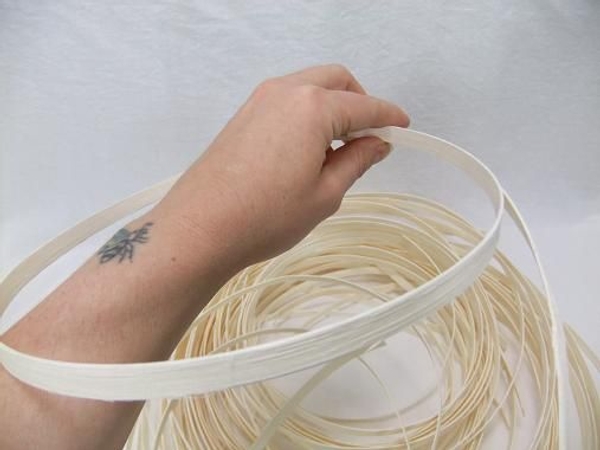 Roll a section of Midelino Cane into a coil Roll a section of Midelino Cane into a coil