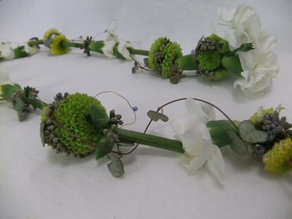 Thread flowers to create floral string that can be worn as a lariat necklace