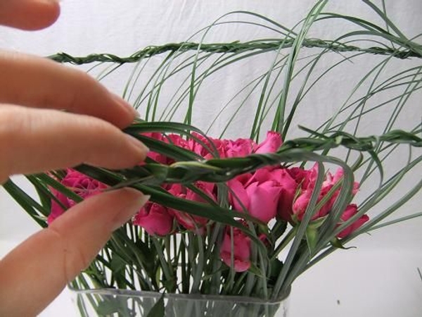 Weave the braid into the first section. Weave the braid into the first section.