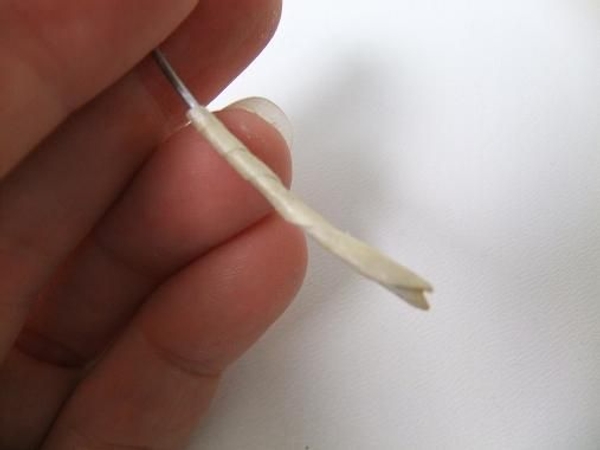 Wrap the Kyogi paper around the wire to create the hollow shaft. Wrap the Kyogi paper around the wire to create the hollow shaft.
