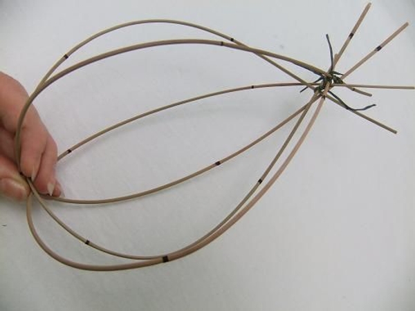 Add more Mikado Reeds to build up the nest shape. Add more Mikado Reeds to build up the nest shape.