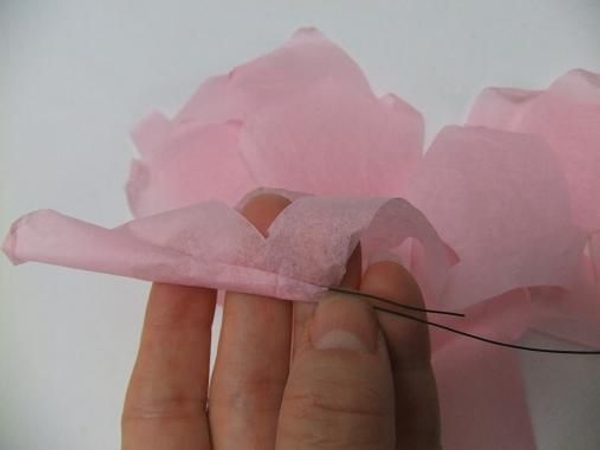 Gently roll the petal to create a bud. Gently roll the petal to create a bud.