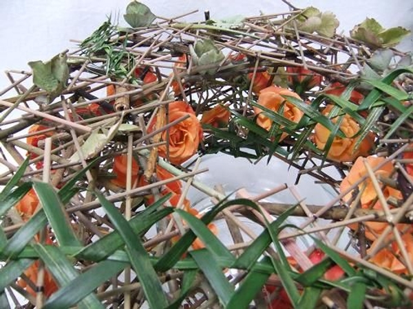 Plaiting a palm thorn garland for the wreath.