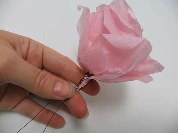 Puff out the petals and secure with the wire. Puff out the petals and secure with the wire.