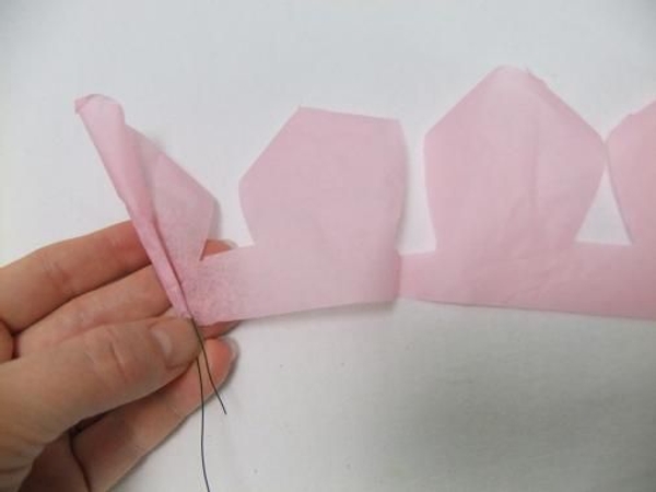 Roll the entire petal garland around the wire. Roll the entire petal garland around the wire.