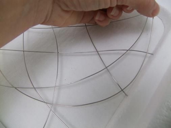 Continue to add and weave in wires. Continue to add and weave in wires.