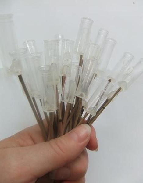 A bunch of test tubes on sticks. A bunch of test tubes on sticks.