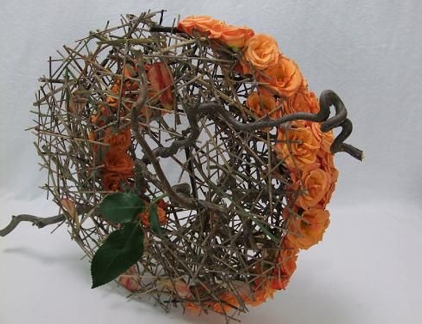 A hazel twig crosses through the design. A hazel twig crosses through the design.
