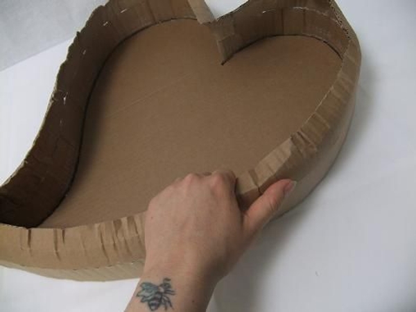 Break the sharp edges by bending the cardboard in your hand.