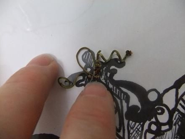 Glue the twigs on to the shape following the pattern. Glue the twigs on to the shape following the pattern.