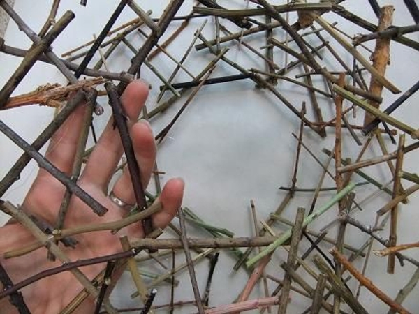 Make a second twig circle exactly the same size as the first. Make a second twig circle exactly the same size as the first.