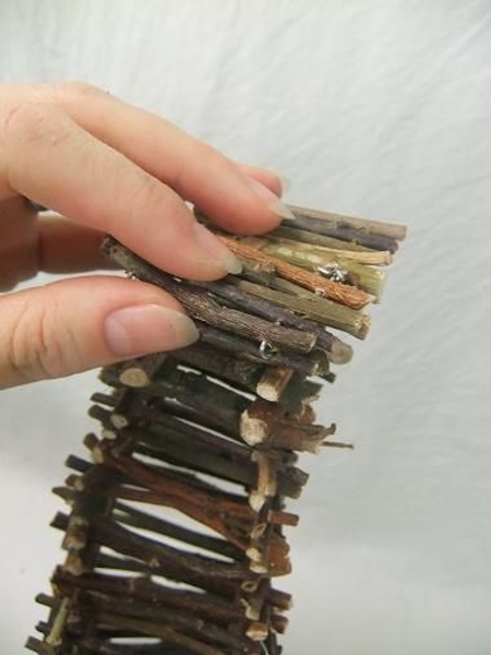 Press down on the twigs to create a flat top. Press down on the twigs to create a flat top.