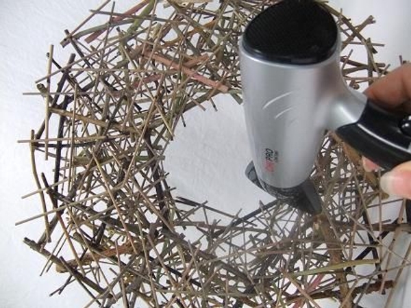 Remove hot glue strands with a hairdryer set on high. Remove hot glue strands with a hairdryer set on high.