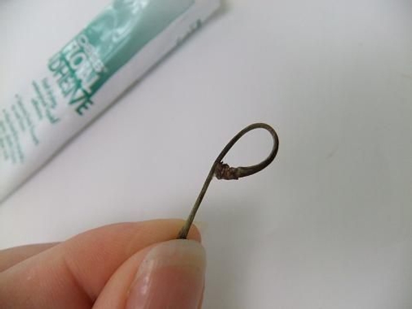 Secure the twig with glue. Secure the twig with glue.