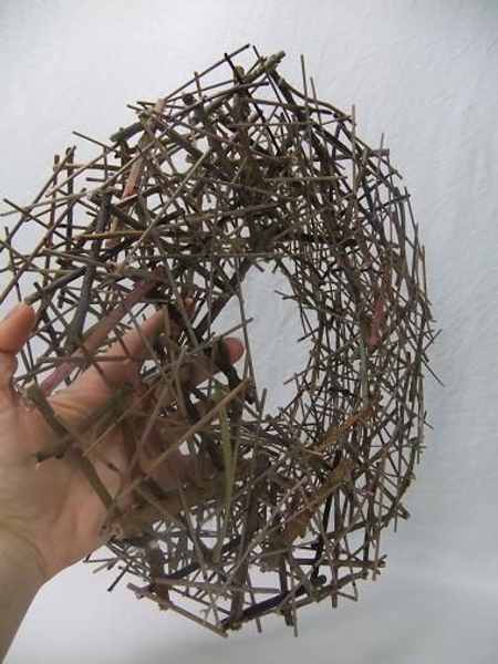 The sticks separating the two circles are ideal to tie test tubes to for the flowers. The sticks separating the two circles are ideal to tie test tubes to for the flowers.