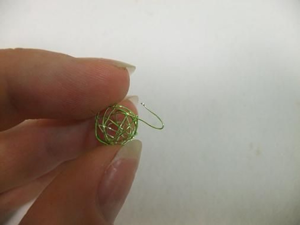 Bend the wire to create a hook. Bend the wire to create a hook.