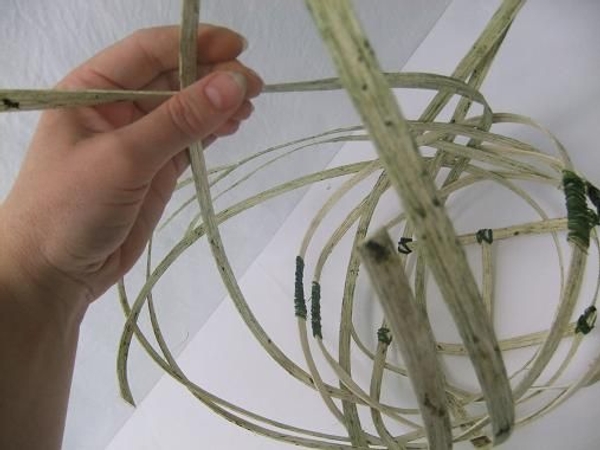 Gather the dangling left over cane strands to make the handle. Gather the dangling left over cane strands to make the handle.