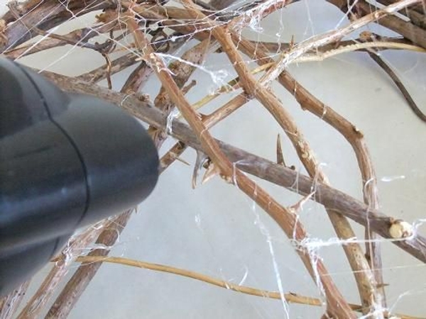 Removing hot glue strands. Removing hot glue strands.