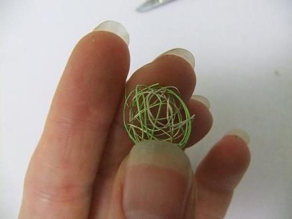 Roll the wire into a ball. Roll the wire into a ball.