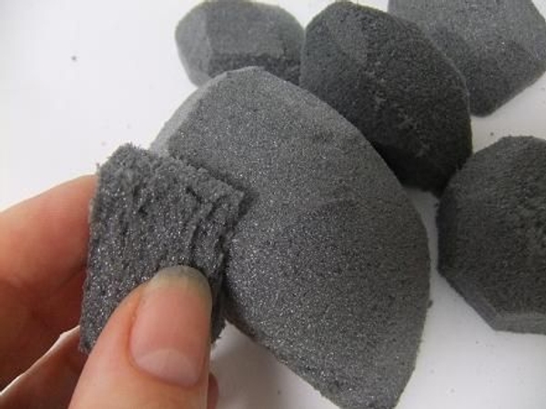 Sand the pebble to a smooth shape with a small piece of foam. Sand the pebble to a smooth shape with a small piece of foam.