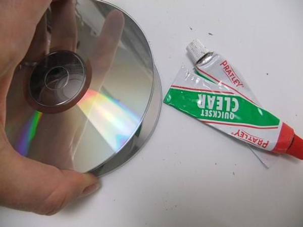 Stack and glue a few used CD's. Stack and glue a few used CD's.