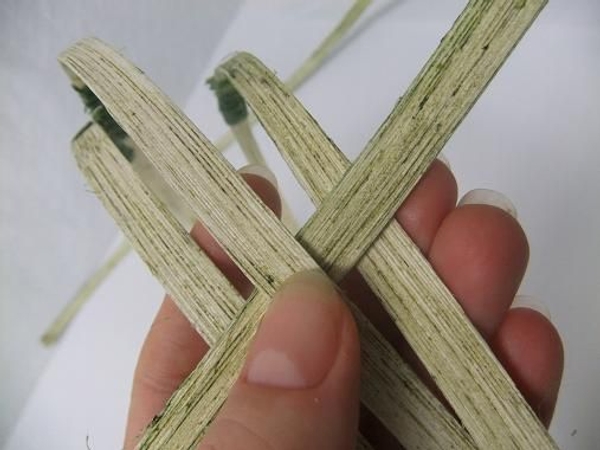 Start to weave the cane into the side. Start to weave the cane into the side.