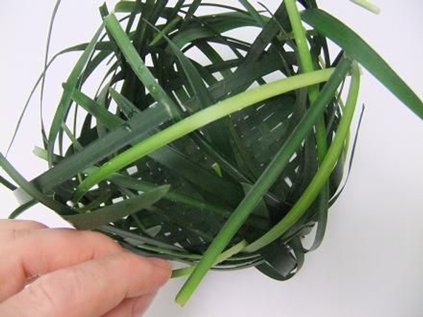 Continue to weave the grass to secure Continue to weave the grass to secure