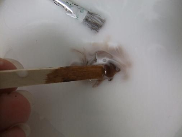 Dilute a bit of wood glue with strong coffee Dilute a bit of wood glue with strong coffee
