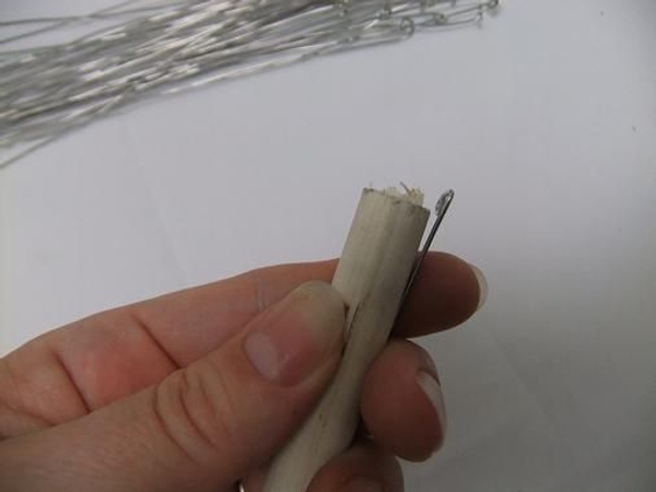 Fit the wire to the dowel and bend the spiral flat. Fit the wire to the dowel and bend the spiral flat.