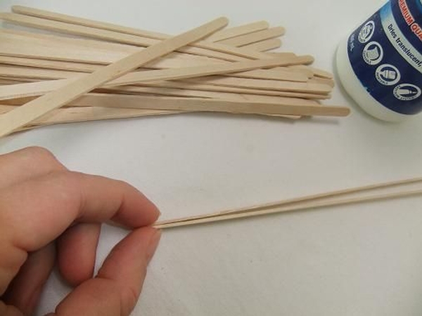Glue the one end of the stir sticks. Glue the one end of the stir sticks.