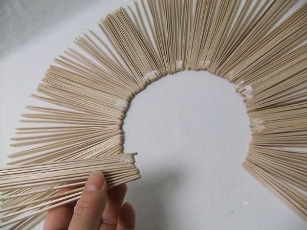 Glue the sections to form the sunburst shape. Glue the sections to form the sunburst shape.