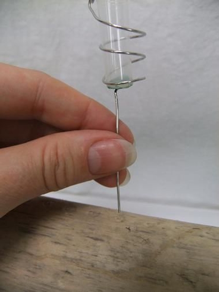 Press the spikes into the wood. Press the spikes into the wood.