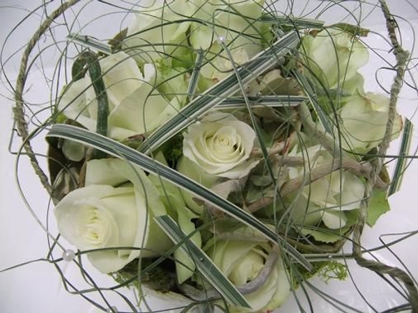 Romantic rose centerpiece with just a bit of an edge. Romantic rose centerpiece with just a bit of an edge.