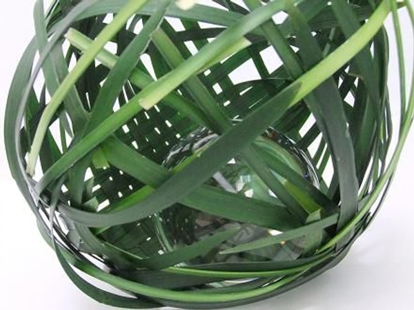 Weave a sphere from grass. Weave a sphere from grass.