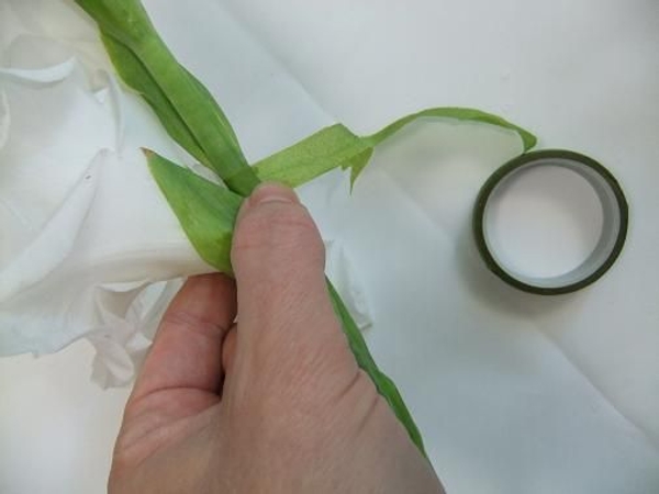 Wrap the stem with florist tape. Wrap the stem with florist tape.