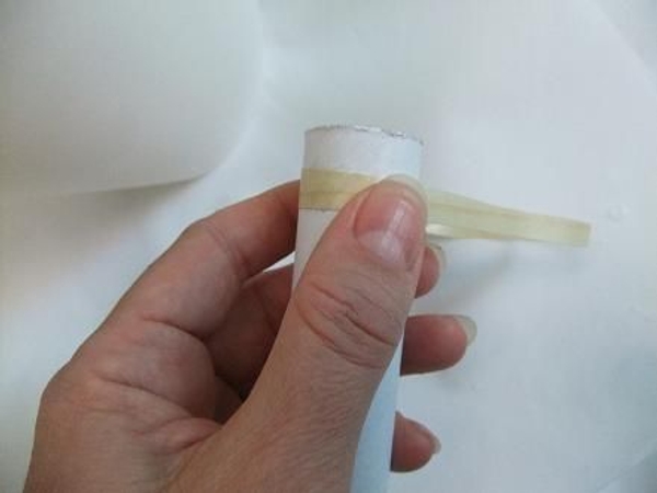 Wrap the wood veneer around a tube. Wrap the wood veneer around a tube.