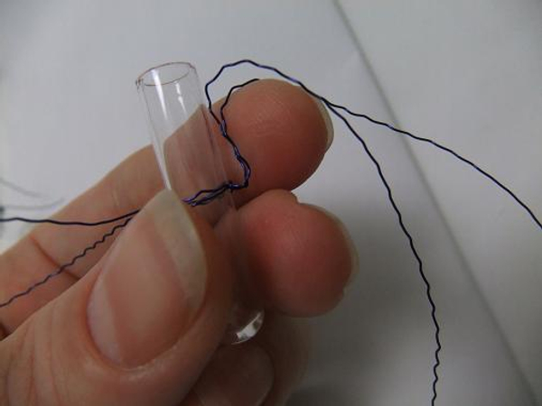 Fold the wire legs up and over your finger and down again.