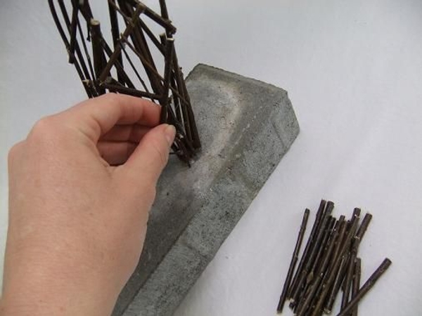 Glue a few twigs to the wire. Glue a few twigs to the wire.