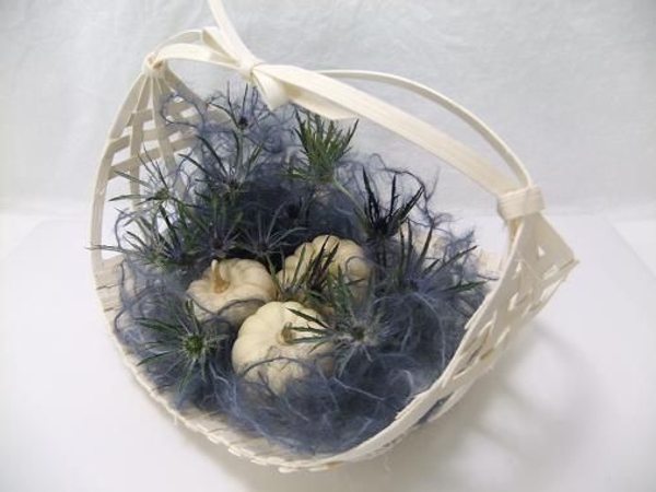 Midelino cane coil harvest basket to display ghost pumpkins. Midelino cane coil harvest basket to display ghost pumpkins.