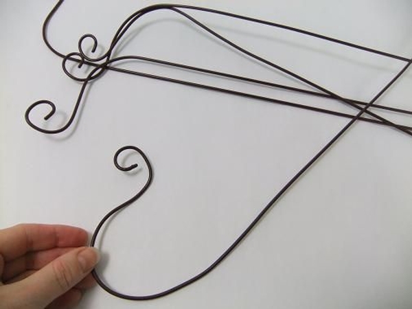 Bend the wire round to point up. Bend the wire round to point up.