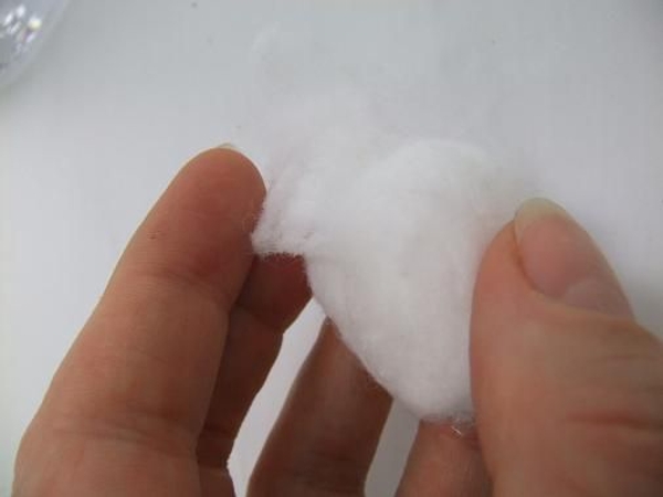 Gently unroll the cotton ball Gently unroll the cotton ball